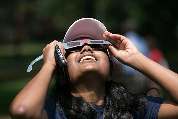 Ohio State student viewing the solar eclipse